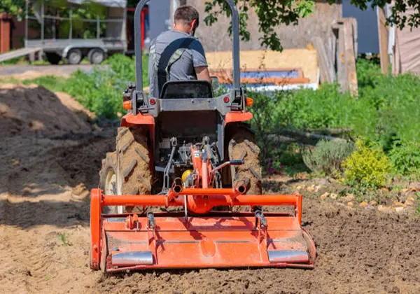 rotary tiller working in field